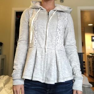 Anthropologie peplum, lace sweatshirt.